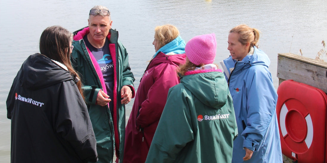 People wearing Sundfœrr changing robe after wild swimming